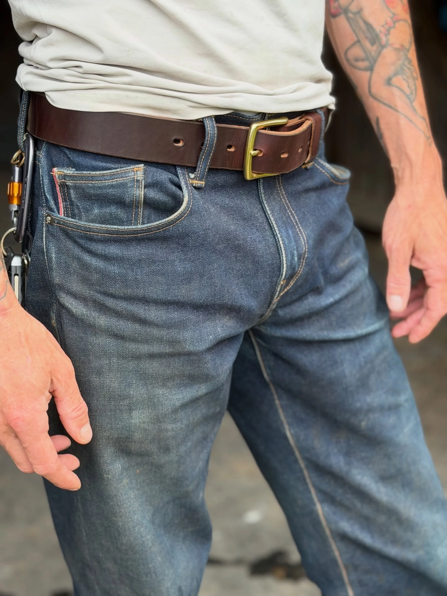Carries a tape, a knife and a phone. No sagging.